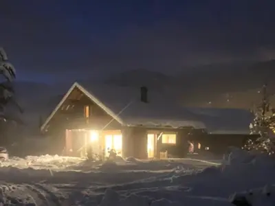 a house covered in snow at night at Chalet spacieux, proche des commerces, animaux admis ! - FR-1-624-118 in Samoëns
