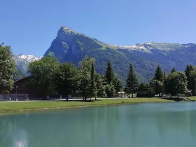 a large lake with a mountain in the background at Chalet spacieux, proche des commerces, animaux admis ! - FR-1-624-118 in Samoëns