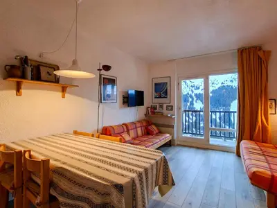 a living room with a table and a couch at Studio lumineux avec balcon et casier à ski proche des pistes - FR-1-425-185 in Arâches-la-Frasse