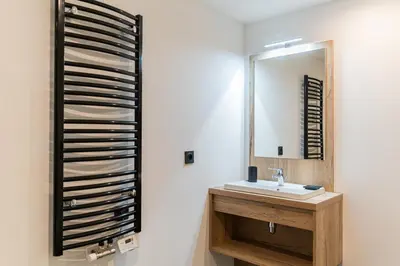 a bathroom with a sink and a mirror at Les Roches du Mont Blanc - Résidence & Spa in Combloux