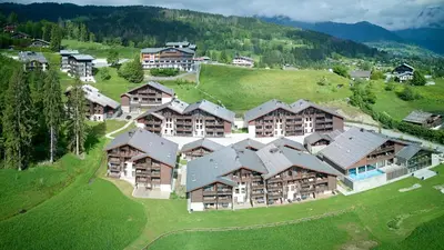 an aerial view of a resort with a bunch of buildings at Les Roches du Mont Blanc - Résidence & Spa in Combloux