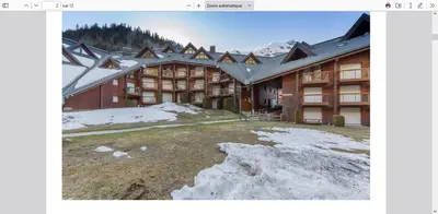 a large building with snow in front of it at Les Pierres Blanches 2 pieces cosy et fonctionnel in Les Contamines-Montjoie