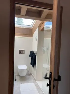 a bathroom with a toilet and a window at LE 1307 in Megève