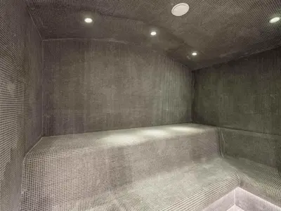 a corner of a shower in a room with tiles at Appartement de Standing à Megève, 5 Min des Pistes, Sauna, Hammam, Parking, Animaux Acceptés - FR-1-569-52 in Megève