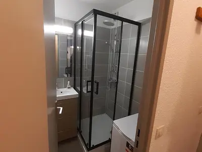 a bathroom with a glass shower and a sink at Appartement Chamonix - 2 Pièces, Casier à ski, Près des bus - FR-1-517-62 in Chamonix-Mont-Blanc