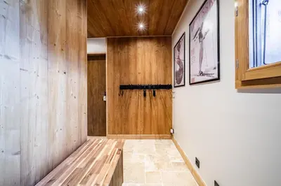 a hallway with a wooden door in a house at Chalet Olea Chamonix - by EMERALD STAY in Chamonix-Mont-Blanc