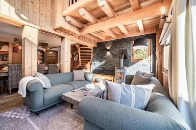 a living room with two couches and a table at Chalet Olea Chamonix - by EMERALD STAY in Chamonix-Mont-Blanc