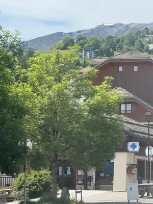 a group of trees in front of a building at A Cordon entre Bois et Nature in Cordon