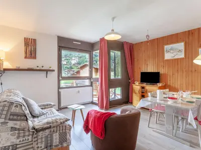 a living room with a couch and a table at Apartment Castel des Roches B20 by Interhome in Saint-Gervais-les-Bains