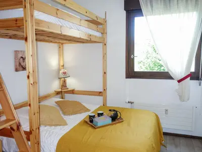 a bedroom with two bunk beds and a window at Apartment Castel des Roches B20 by Interhome in Saint-Gervais-les-Bains