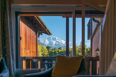 a view of a mountain from a window at Ski-in/ski-out & pool: great for summer and winter in Saint-Gervais-les-Bains