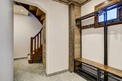 a room with wooden walls and a staircase at Chalet Chèvrefeuille in Saint-Gervais-les-Bains