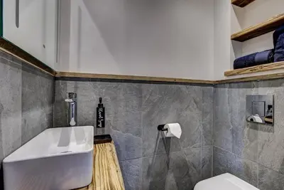 a bathroom with a sink and a toilet at Chalet Chèvrefeuille in Saint-Gervais-les-Bains