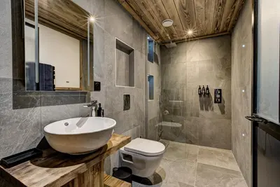 a bathroom with a sink and a toilet at Chalet Chèvrefeuille in Saint-Gervais-les-Bains