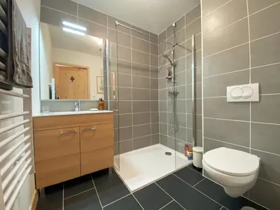 a bathroom with a shower and a toilet and a sink at Charmant T3 Neuf, Skibus Gratuit, Terrasse, 2 Places Privées, WIFI - Samoëns - FR-1-624-122 in Samoëns