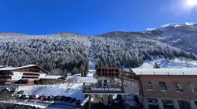 a view of a ski lodge with a snow covered mountain at Exceptionnel duplex en Residence & Spa Vallorcine Mont-Blanc 5 étoiles in Vallorcine