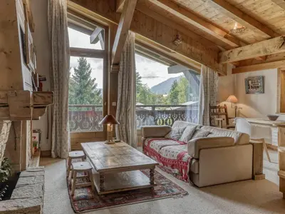 a living room with a couch and a table at Charmant appartement 2 chambres à Megève avec Wifi et parking - FR-1-453-292 in Megève
