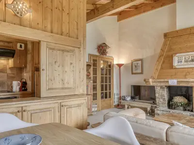 a living room with wooden walls and a fireplace at Charmant appartement 2 chambres à Megève avec Wifi et parking - FR-1-453-292 in Megève