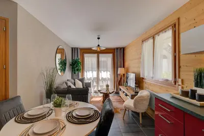 a kitchen and living room with a table and chairs at Apartment Aiguille de Chamonix- Alpes Travel - Central Chamonix (sleeps 4) in Chamonix-Mont-Blanc