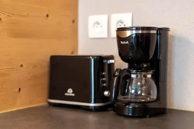 a coffee maker sitting on top of a counter at Apartment Aiguille de Chamonix- Alpes Travel - Central Chamonix (sleeps 4) in Chamonix-Mont-Blanc