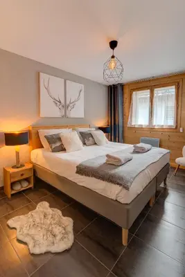 a bedroom with a large bed in a room at Apartment Aiguille de Chamonix- Alpes Travel - Central Chamonix (sleeps 4) in Chamonix-Mont-Blanc