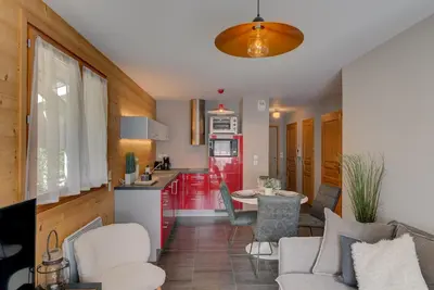 a kitchen and living room with a table and chairs at Apartment Aiguille de Chamonix- Alpes Travel - Central Chamonix (sleeps 4) in Chamonix-Mont-Blanc