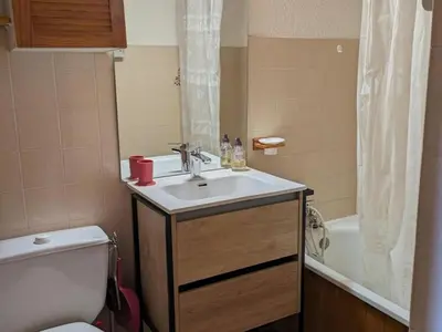 a bathroom with a sink and a toilet and a tub at Studio 4 pers avec balcon, près des remontées mécaniques - FR-1-572-149 in Arâches-la-Frasse