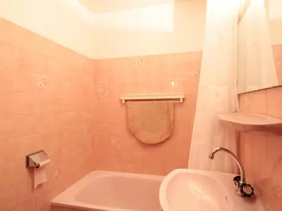 a bathroom with a tub and a toilet and a sink at Studio 4 pers avec balcon, proche pistes et commerces, centre village - FR-1-572-165 in Arâches-la-Frasse
