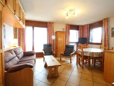 a living room with a couch and a table at Studio spacieux 4 pers avec parking et lave-vaisselle - FR-1-572-93 in Arâches-la-Frasse