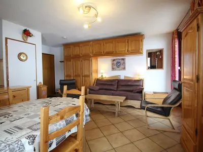 a living room with a couch and a table at Studio spacieux 4 pers avec parking et lave-vaisselle - FR-1-572-93 in Arâches-la-Frasse