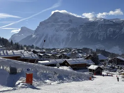 a ski resort with a snow covered mountain in the background at Studio spacieux 4 pers avec parking et lave-vaisselle - FR-1-572-93 in Arâches-la-Frasse