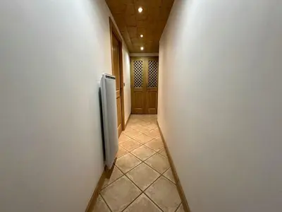 a hallway with a refrigerator in a wall at Appartement 3 pièces avec garage, terrasse, proche pistes et commerces à Arâches-la-Frasse - FR-1-572-250 in Arâches-la-Frasse
