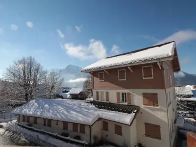 a building with snow on top of it at Appartement 3 pièces avec garage, terrasse, proche pistes et commerces à Arâches-la-Frasse - FR-1-572-250 in Arâches-la-Frasse