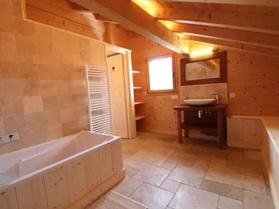 a large bathroom with a tub and a sink at Chalet cosy 12 pers. à 1km des pistes, 5 ch., WiFi, cheminée, abri voiture - FR-1-572-30 in Arâches-la-Frasse