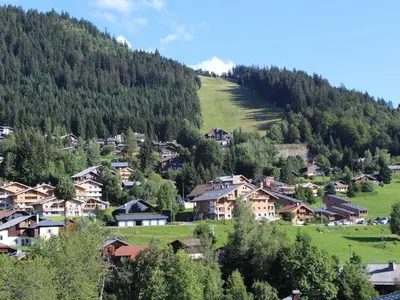 a village in the mountains with houses and trees at Spacieux 3 pièces au centre d'Arâches-la-Frasse, 6 pers., proche pistes et commerces - FR-1-572-69 in Arâches-la-Frasse