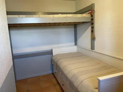a small room with a bed in a closet at Duplex lumineux 3 pièces, 7 pers, 3 balcons, proche pistes et commerces, parking, ski bus - FR-1-572-72 in Arâches-la-Frasse