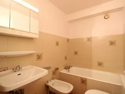 a bathroom with a sink and a toilet and a tub at Duplex 6 pers sur pistes débutants avec parking - Les Carroz d'Arâches - FR-1-572-74 in Arâches-la-Frasse