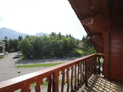 a balcony of a house with a view of a parking lot at Chalet typique 10 pers, Arâches-la-Frasse - FR-1-572-27 in Arâches-la-Frasse