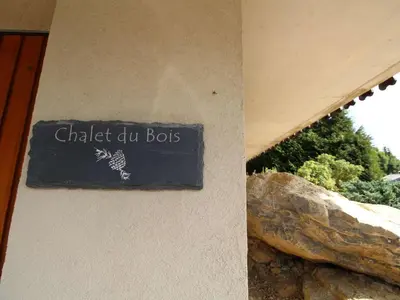 a sign on the side of a building that reads chalk jug bots at Chalet typique 10 pers, Arâches-la-Frasse - FR-1-572-27 in Arâches-la-Frasse