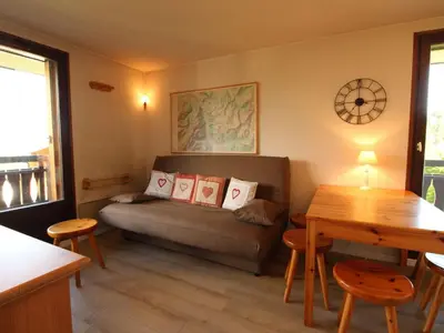 a living room with a couch and a table at Appartement 2 pièces 5 pers, pied des pistes, garage privé, proche village et commerces - FR-1-572-57 in Arâches-la-Frasse