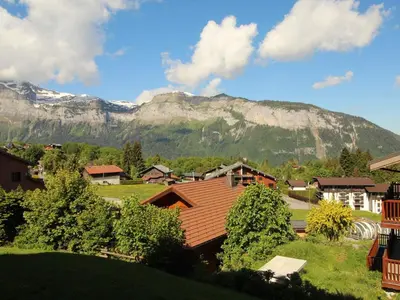 a village with a mountain in the background at Appartement 2 pièces 5 pers, pied des pistes, garage privé, proche village et commerces - FR-1-572-57 in Arâches-la-Frasse