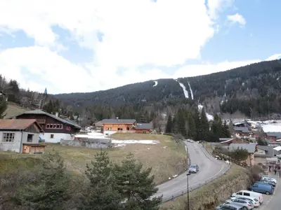 a view of a town with a road and a mountain at Studio 4 pers, cabine, Les Carroz, proche pistes - FR-1-572-95 in Arâches-la-Frasse