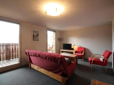 a living room with a couch and a window at 3 Pièces 6 Pers, Proche Pistes & Centre, Balcon Sud, Parking, Non-Fumeur - FR-1-572-158 in Arâches-la-Frasse