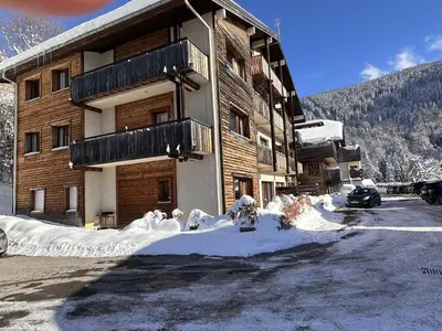 a building with snow on the ground in front of it at 3 Pièces 6 Pers, Proche Pistes & Centre, Balcon Sud, Parking, Non-Fumeur - FR-1-572-158 in Arâches-la-Frasse