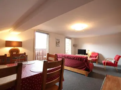 a living room with a couch and a table at 3 Pièces 6 Pers, Proche Pistes & Centre, Balcon Sud, Parking, Non-Fumeur - FR-1-572-158 in Arâches-la-Frasse