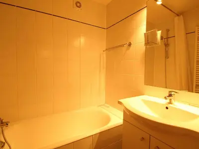 a bathroom with a tub and a sink and a bath tub at Chalet 5 ch, 11 pers, terrasse sud, Les Carroz - FR-1-572-115 in Arâches-la-Frasse