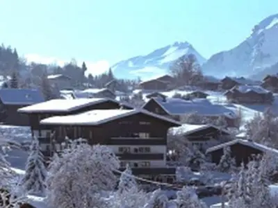 a snow covered village with mountains in the background at Studio spacieux 4 pers, lit double, pistes, parking - FR-1-572-146 in Arâches-la-Frasse