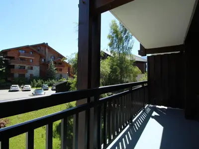 a balcony of a house with a view of a street at Studio rénové 4 pers, centre village, proche pistes et commerces - FR-1-572-61 in Arâches-la-Frasse