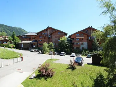 a street in a village with cars parked on the road at Studio rénové 4 pers, centre village, proche pistes et commerces - FR-1-572-61 in Arâches-la-Frasse