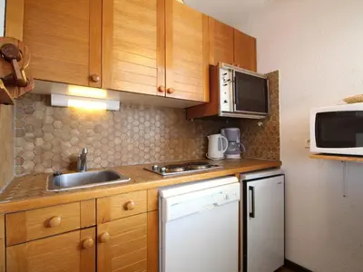 a small kitchen with a sink and a microwave at Studio 4 pers. proche pistes et commerces, balcon, parking - FR-1-572-131 in Arâches-la-Frasse